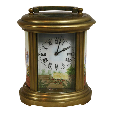 Oval Brass and Glass Clock with Cherubs
