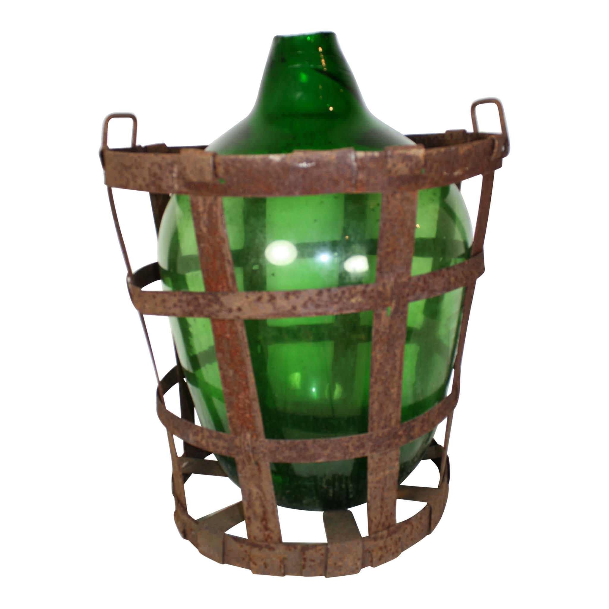 Green Glass Bottle in Metal Basket