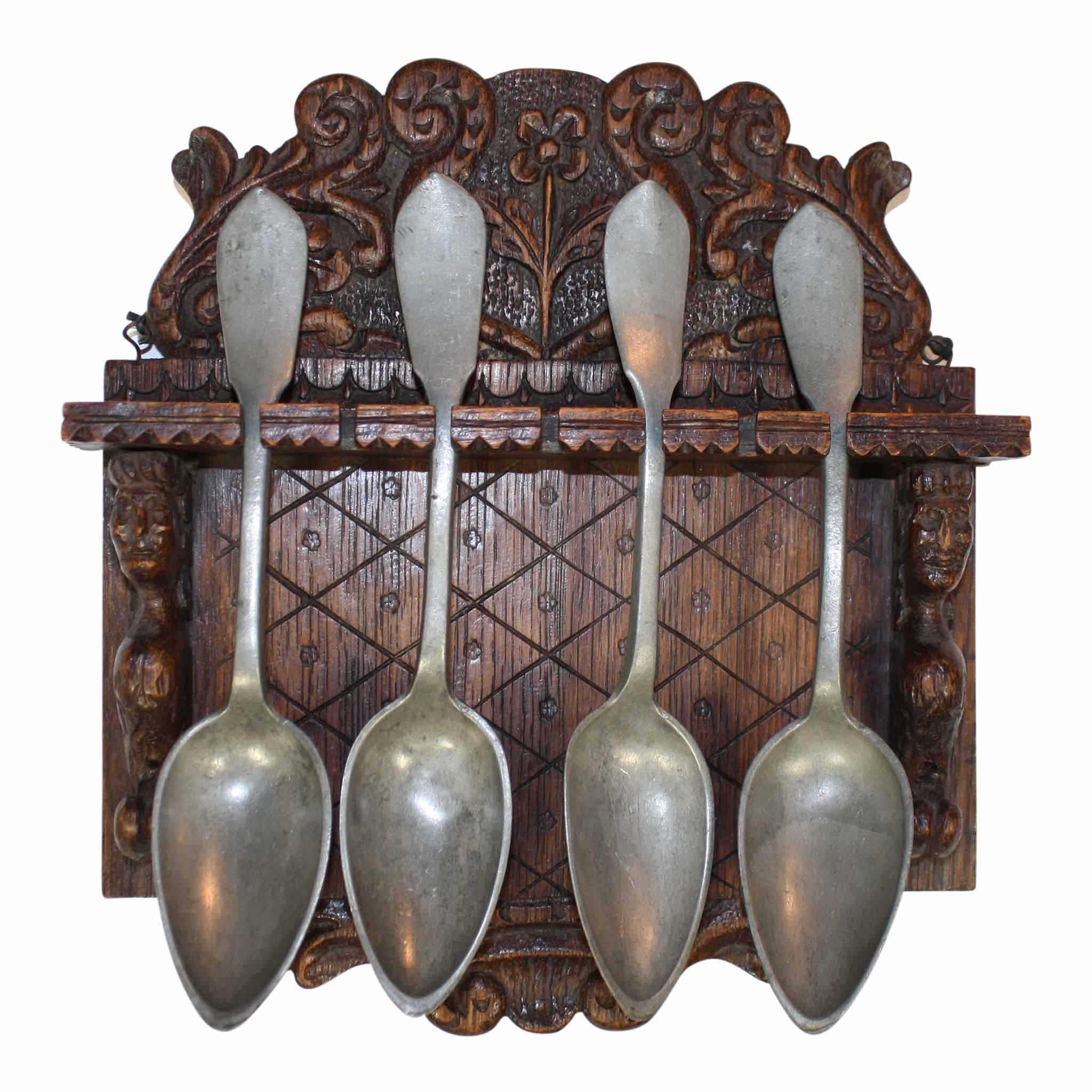 Four Pewter Spoons in Rack